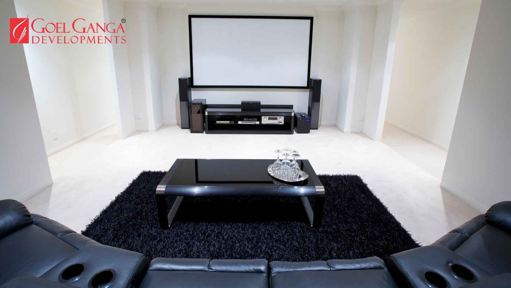 Experiential Living - home cinema interior featuring fiber-optic star ceiling and custom Dolby Atmos surround sound system in a premium property by Goel Ganga Developments."
