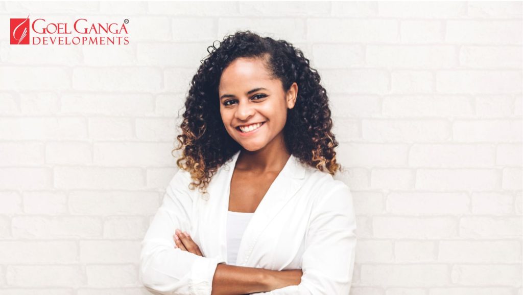 Confident woman reviewing plans for a modern residential project, representing the growing influence of women homebuyers in India's real estate market.